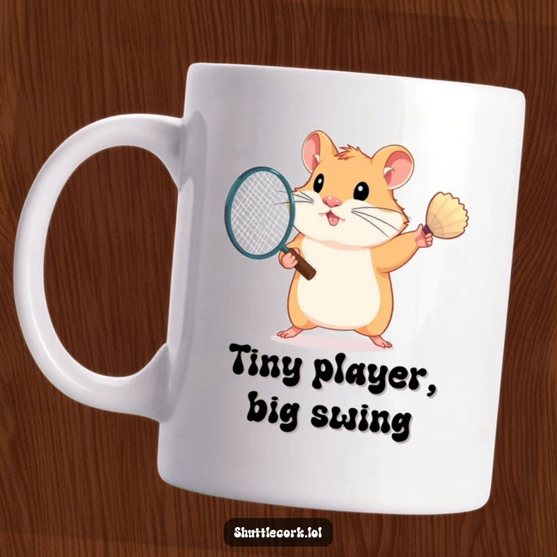 Funny hamster mug with a determined expression, swinging a mini badminton racket with one furry paw, ready for action.