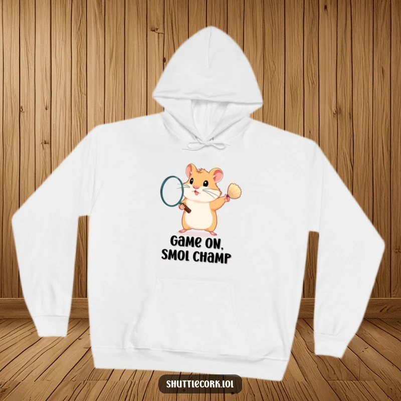 Funny hoodie design showing a determined hamster passionately swinging a badminton racket, ready to win, with a cozy feel.